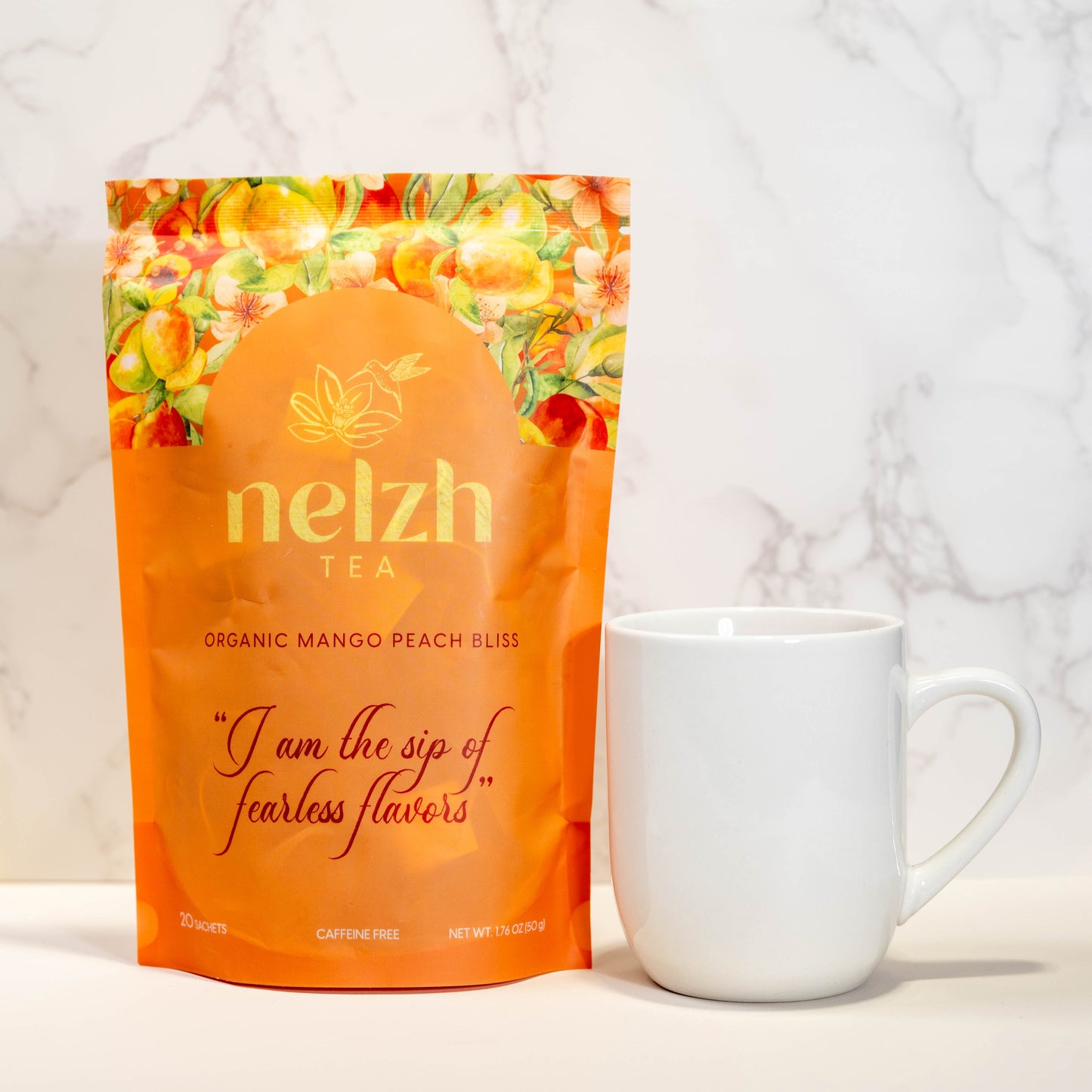 Nelzh Tea Organic Mango Peach Bliss, a pouch of 20 caffeine-free tea sachets with a sweet mango and peach flavor.