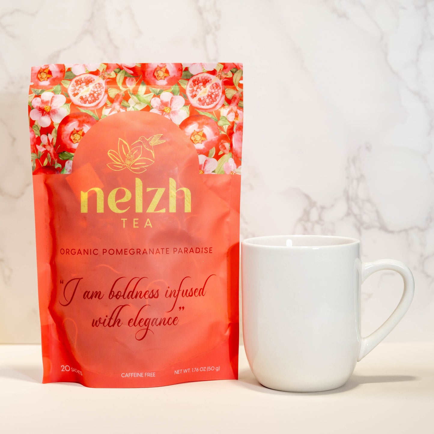 Nelzh Tea Organic Pomegranate Paradise, a pouch of 20 caffeine-free sachets of organic tea with pomegranate and floral notes.