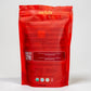 he back of the Nelzh Tea bag, Apple Sensation. The text describes the company's commitment to organic ingredients and sustainability, with a QR code, company address, and a list of ingredients.
