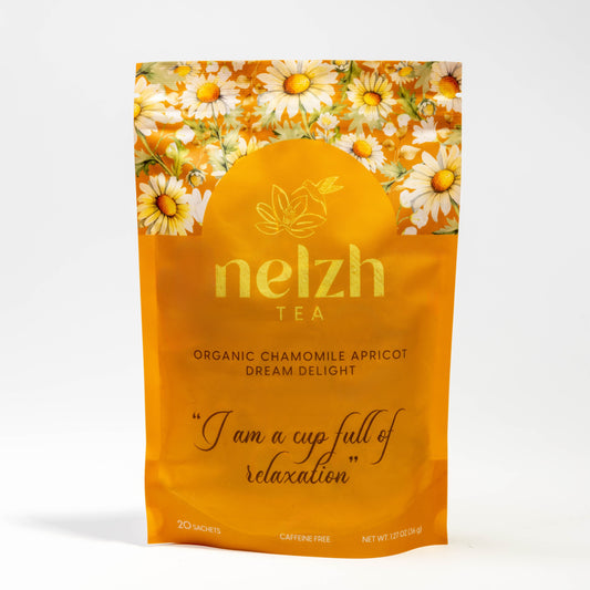 Nelzh Tea Organic Chamomile Apricot Dream Delight, an orange pouch of 20 caffeine-free sachets.
