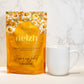Nelzh Tea Organic Chamomile Apricot Dream Delight, an orange pouch of 20 caffeine-free tea sachets.