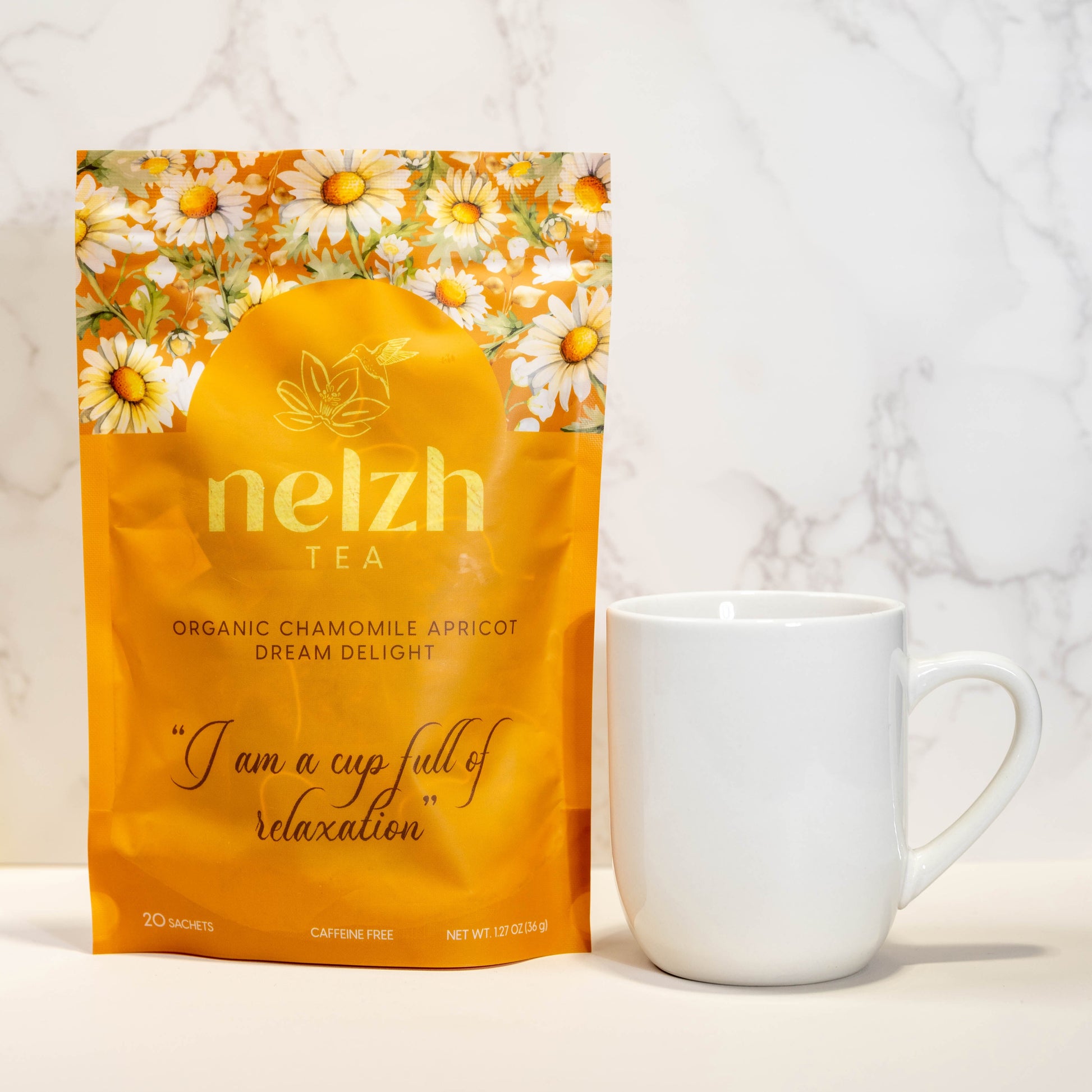 Nelzh Tea Organic Chamomile Apricot Dream Delight, an orange pouch of 20 caffeine-free tea sachets.