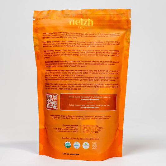 The back of the Nelzh Tea Organic Mango Peach Bliss bag, displaying a list of ingredients including organic rosehips, lemongrass, and chamomile.