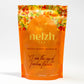 Nelzh Tea Organic Mango Peach Bliss, a pouch of 20 caffeine-free tea sachets.