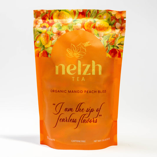 Nelzh Tea Organic Mango Peach Bliss, a pouch of 20 caffeine-free tea sachets.