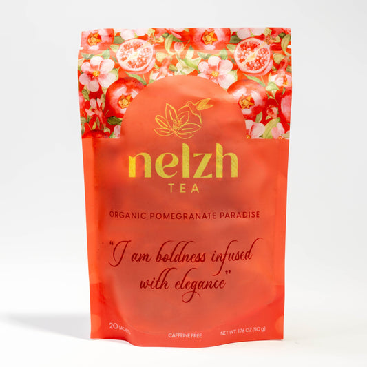 Nelzh Tea Organic Pomegranate Paradise, a pouch of 20 caffeine-free tea sachets.